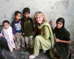 Laurie bonding with children of a family affected by haemophilia in Pakistan (2012)